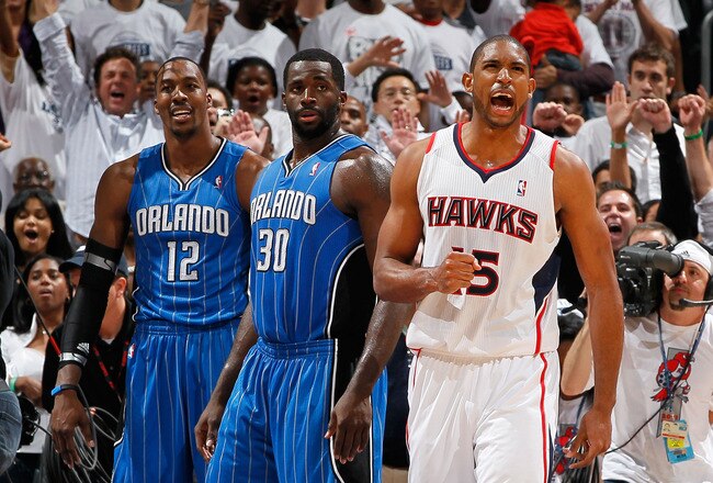 ATLANTA, GA - APRIL 22:  Al Horford #15 of the Atlanta Hawks reacts after their 88-84 win over Dwight Howard #12, Brandon Bass #30 and the Orlando Magic during Game Three of the Eastern Conference Quarterfinals in the 2011 NBA Playoffs at Philips Arena on April 22, 2011 in Atlanta, Georgia.  (Photo by Kevin C. Cox/Getty Images)