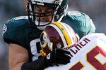 PHILADELPHIA, PA - JANUARY 01:   London Fletcher #59 of the Washington Redskins tackles Brent Celek #87 of the Philadelphia Eagles during a game at Lincoln Financial Field on January 1, 2012 in Philadelphia, Pennsylvania.  (Photo by Patrick McDermott/Getty Images)