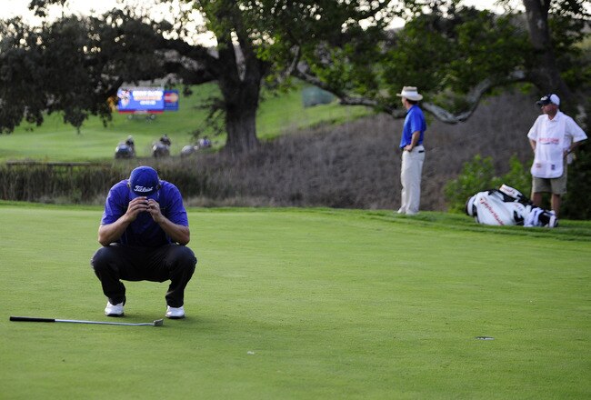 SAN MARTIN, CA - OCTOBER 09:  Bryce Molder reacts to making a birdie putt and winning the Frys.com Open as Briny Baird and his caddie stand in the background at the CordeValle Golf Club on October 9, 2011 in San Martin, California.  (Photo by Robert Laberge/Getty Images)