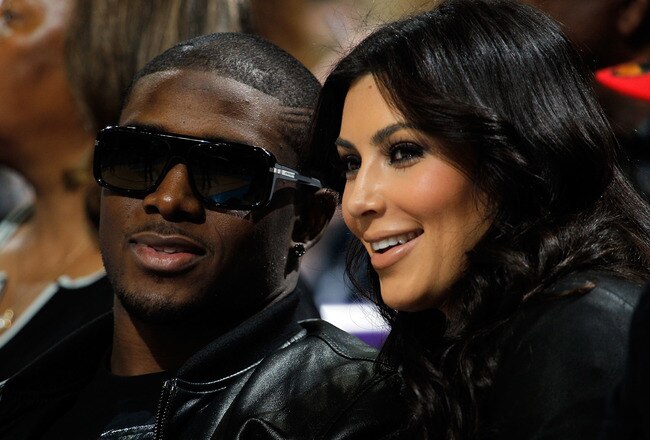 NEW ORLEANS - JANUARY 18:  New Orleans Saints player Reggie Bush sits with Kim Kardashian on the court during the game between the San Antonio Spurs and the New Orleans Hornets at New Orleans Arena on January 18, 2010 in New Orleans, Louisiana.   NOTE TO USER: User expressly acknowledges and agrees that, by downloading and/or using this Photograph, User is consenting to the terms and conditions of the Getty Images License Agreement.  (Photo by Chris Graythen/Getty Images)
