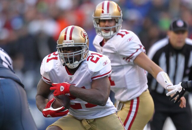 SEATTLE - DECEMBER 24:  Running back Frank Gore #21 of the San Francisco 49ers rushes against the Seattle Seahawks at CenturyLink Field on December 24, 2011 in Seattle, Washington. (Photo by Otto Greule Jr/Getty Images)