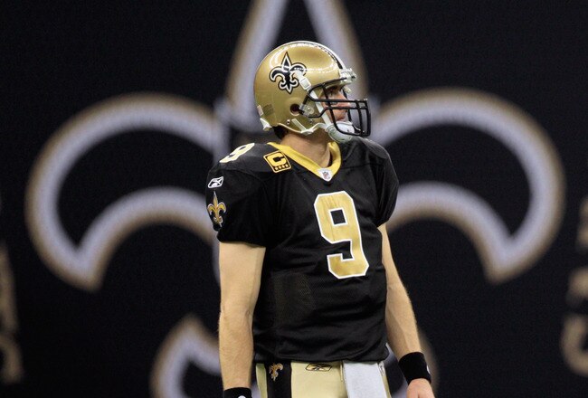 NEW ORLEANS, LA - JANUARY 01:  Drew Brees #9 of the New Orleans Saints stands on the field during the game against the Carolina Panthers at the Mercedes-Benz Superdome on January 1, 2012 in New Orleans, Louisiana.  (Photo by Chris Graythen/Getty Images)