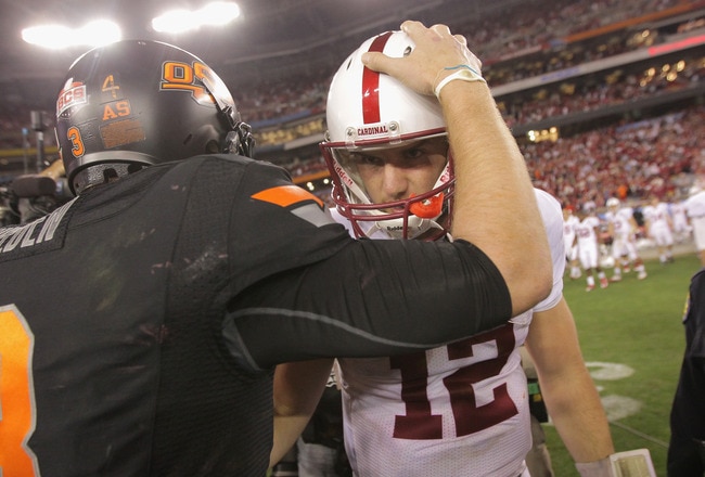 GLENDALE, AZ - JANUARY 02:  Andrew Luck (R) #12 of the Stanford Cardinal congratulates Brandon Weeden #3 of the Oklahoma State Cowboys after Oklahoma State Cowboys won 41-38 in overtime during the Tostitos Fiesta Bowl on January 2, 2012 at University of Phoenix Stadium in Glendale, Arizona.  (Photo by Doug Pensinger/Getty Images)