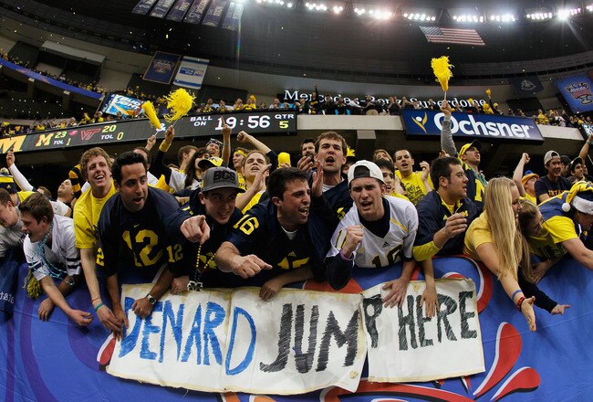 NEW ORLEANS, LA - JANUARY 03:  Fans of the Michigan Wolverines celebrate afer Michigan won 23-20 in overtime against the Virginia Tech Hokies during the Allstate Sugar Bowl at Mercedes-Benz Superdome on January 3, 2012 in New Orleans, Louisiana.  (Photo by Kevin C. Cox/Getty Images)