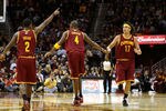 CLEVELAND, OH - DECEMBER 26: Kyrie Irving #2, Antawn Jamison #4 and Anderson Varejao #17 react after a play against the Toronto Raptors during the season opener at Quicken Loans Arena on December 26, 2011 in Cleveland, Ohio. NOTE TO USER: User expressly acknowledges and agrees that, by downloading and or using this photograph, User is consenting to the terms and conditions of the Getty Images License Agreement.  (Photo by Mike Lawrie/Getty Images)
