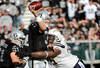OAKLAND, CA - JANUARY 01:  Carson Palmer #3 of the Oakland Raiders gets his pass off under pressure from Cam Thomas #76 of the San Diego Chargers at O.co Coliseum on January 1, 2012 in Oakland, California.  (Photo by Thearon W. Henderson/Getty Images)