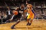 SACRAMENTO, CA - DECEMBER 26:  Tyreke Evans #13 of the Sacramento Kings drives on Derek Fisher #2 of the Los Angeles Lakers at Power Balance Pavilion on December 26, 2011 in Sacramento, California.  NOTE TO USER: User expressly acknowledges and agrees that, by downloading and or using this photograph, User is consenting to the terms and conditions of the Getty Images License Agreement.  (Photo by Ezra Shaw/Getty Images)