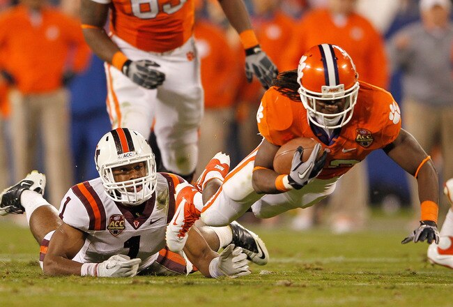 CHARLOTTE, NC - DECEMBER 03: Sammy Watkins #2 of the Clemson Tigers is tackled by Antone Exum #1 of the Virginia Tech Hokies during the ACC Championship game at Bank of America Stadium on December 3, 2011 in Charlotte, North Carolina.  (Photo by Mike Ehrmann/Getty Images)