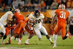 MIAMI GARDENS, FL - JANUARY 04: Shawne Alston #20 of the West Virginia Mountaineers runs the ball in the first quarter against the Clemson Tigers  during the Discover Orange Bowl at Sun Life Stadium on January 4, 2012 in Miami Gardens, Florida.  (Photo by Streeter Lecka/Getty Images)