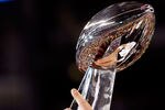 ARLINGTON, TX - FEBRUARY 06:  Quarterback Aaron Rodgers #12 of the Green Bay Packers holds up the VInce Lombardi trophy after the Packers won 31-25 against the Pittsburgh Steelers during Super Bowl XLV at Cowboys Stadium on February 6, 2011 in Arlington, Texas.  (Photo by Kevin C. Cox/Getty Images)