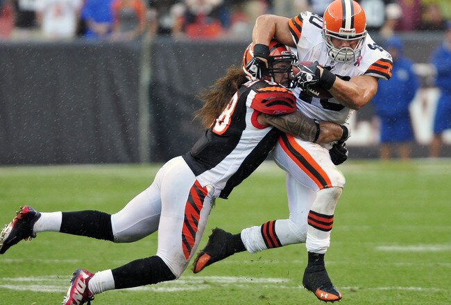 CLEVELAND, OH - SEPTEMBER 11: Linebacker Rey Maualuga #58 of the Cincinnati Bengals tackles Peyton Hillis #40 of the Cleveland Browns during the fourth quarter at Cleveland Browns Stadium during a season opener  on September 11, 2011 in Cleveland, Ohio. The Bengals defeated the Browns 27-17.  (Photo by Jason Miller/Getty Images)