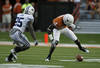 AUSTIN, TX - SEPTEMBER 10:  Wide receiver Darius White #4 of the Texas Longhorns fumbles a second quarter pass as defensive back Corby Eason #25 of the BYU Cougars comes in to tackle on September 10, 2011 at Darrell K. Royal-Texas Memorial Stadium in Austin, Texas.  White recovered his own fumble. (Photo by Erich Schlegel/Getty Images)
