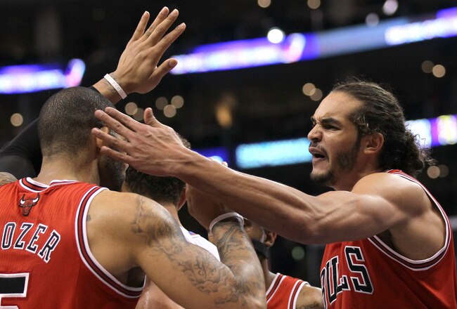LOS ANGELES, CA - DECEMBER 30: Joakim Noah #13 of the Chicago Bulls celebrates with Carlos Boozer #5 in the fourth quarter against the Los Angeles Clippers at Staples Center on December 30, 2011 in Los Angeles, California.  The Bulls won 114-101.  NOTE TO USER: User expressly acknowledges and agrees that, by downloading and or using this photograph, User is consenting to the terms and conditions of the Getty Images License Agreement.  (Photo by Stephen Dunn/Getty Images)