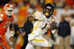 MIAMI GARDENS, FL - JANUARY 04:  Tavon Austin #1 of the West Virginia Mountaineers scores a 37-yard touchdown reception in the third quarter against the Clemson Tigers during the Discover Orange Bowl at Sun Life Stadium on January 4, 2012 in Miami Gardens, Florida.  (Photo by Streeter Lecka/Getty Images)
