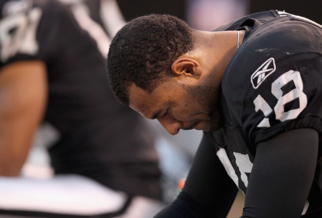 OAKLAND, CA - JANUARY 01:  Louis Murphy #18 of the Oakland Raiders sits on the sidelines during the closing minutes of their loss to the San Diego Chargers at O.co Coliseum on January 1, 2012 in Oakland, California.  (Photo by Ezra Shaw/Getty Images)