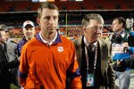 MIAMI GARDENS, FL - JANUARY 04:  Head coach Dabo Swinney of the Clemson Tigers walks off of the field dejected after they lost to the West Virginia Mountaineers 70-33 during the Discover Orange Bowl at Sun Life Stadium on January 4, 2012 in Miami Gardens, Florida.  (Photo by Streeter Lecka/Getty Images)