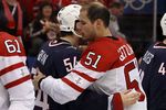 VANCOUVER, BC - FEBRUARY 28:  Bobby Ryan #54 of USA and Ryan Getzlaf #51 of Canada hug after the ice hockey men's gold medal game between USA and Canada on day 17 of the Vancouver 2010 Winter Olympics at Canada Hockey Place on February 28, 2010 in Vancouver, Canada. Canada defeated USA 3-2 in overtime. (Photo by Bruce Bennett/Getty Images)