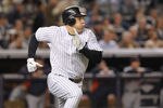 NEW YORK, NY - OCTOBER 06:  Mark Teixeira #25 of the New York Yankees runs towards first base against the Detroit Tigers during Game Five of the American League Championship Series at Yankee Stadium on October 6, 2011 in the Bronx borough of New York City.  (Photo by Nick Laham/Getty Images)