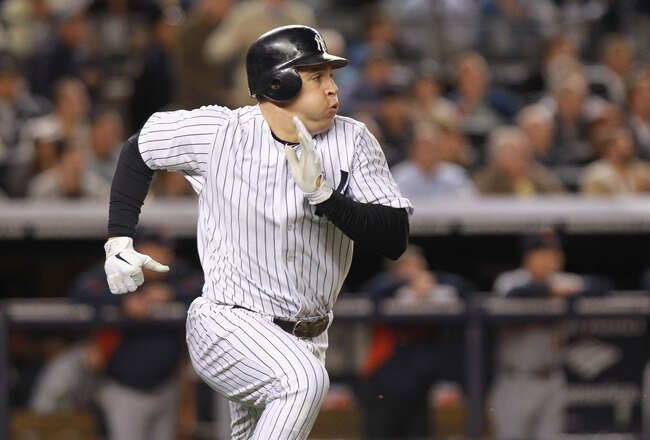 NEW YORK, NY - OCTOBER 06:  Mark Teixeira #25 of the New York Yankees runs towards first base against the Detroit Tigers during Game Five of the American League Championship Series at Yankee Stadium on October 6, 2011 in the Bronx borough of New York City.  (Photo by Nick Laham/Getty Images)