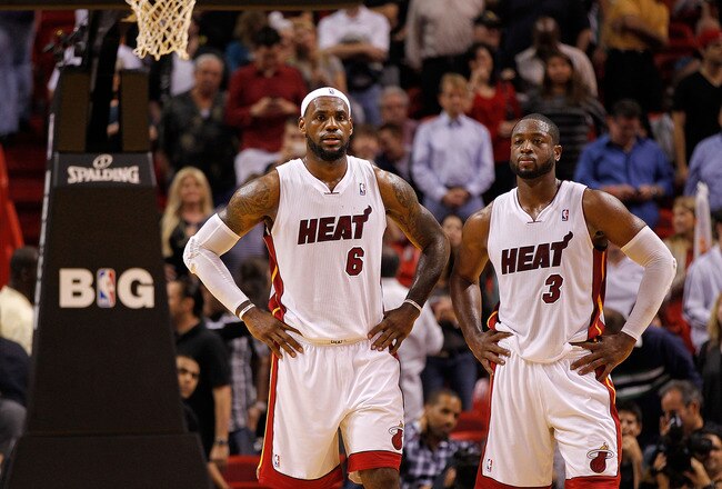 MIAMI, FL - DECEMBER 27:  LeBron James #6 and Dwyane Wade #3 of the Miami Heat look on during a game against the Boston Celtics at American Airlines Arena on December 27, 2011 in Miami, Florida. NOTE TO USER: User expressly acknowledges and agrees that, by downloading and/or using this Photograph, User is consenting to the terms and conditions of the Getty Images License Agreement.  (Photo by Mike Ehrmann/Getty Images)
