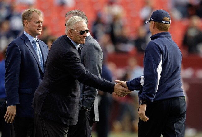 LANDOVER, MD - NOVEMBER 20: Dallas Cowboys owner Jerry Jones (L) shakes hands with head coach Jason Garrett (R) before the start of the Cowboys game against the Washington Redskins at FedExField on November 20, 2011 in Landover, Maryland.  (Photo by Rob Carr/Getty Images)
