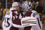 BOSTON, MA - OCTOBER 10:  Semyon Varlamov #1 of the Colorado Avalanche is congratulated by teammate Jean-Sebastien Giguere #35 after Varlamov shut out the Boston Bruins on October 10, 2011 at TD Garden in Boston, Massachusetts. The Colorado Avalanche defeated the Boston Bruins 1-0.  (Photo by Elsa/Getty Images)