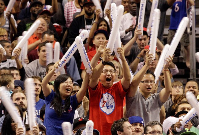 PHILADELPHIA, PA - APRIL 24: Philadelphia 76ers fans cheer during the second half of their 86-82 win over the Miami Heat in Game Four of the Eastern Conference Quarterfinals in the 2011 NBA Playoffs at Wells Fargo Center on April 24, 2011 in Philadelphia, Pennsylvania. NOTE TO USER: User expressly acknowledges and agrees that, by downloading and/or using this Photograph, User is consenting to the terms and conditions of the Getty Images License Agreement.  (Photo by Rob Carr/Getty Images)