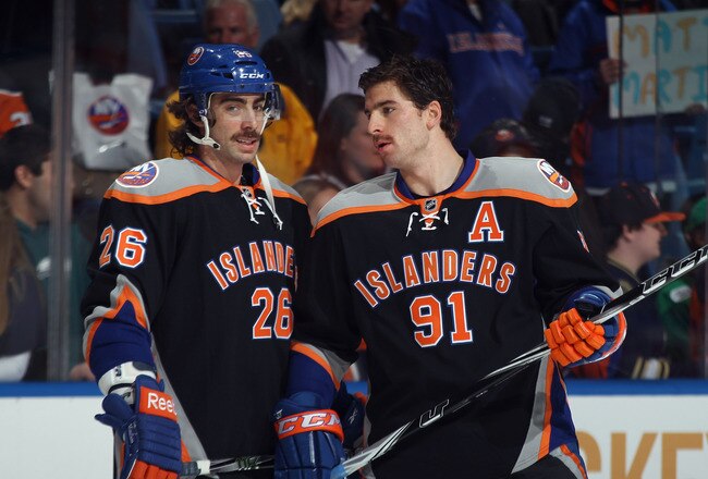 UNIONDALE, NY - NOVEMBER 23: Matt Moulson #26 and John Tavares #91 of the New York Islanders skate in warmups prior to the game against the Philadelphia Flyers at the Nassau Veterans Memorial Coliseum on November 23, 2011 in Uniondale, New York.  (Photo by Bruce Bennett/Getty Images)