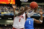 ATLANTA, GA - MARCH 12:  Tony Mitchell #5 of the Alabama Crimson Tide shoots against Darius Miller #1 of the Kentucky Wildcats during the semifinals of the SEC Men's Basketball Tournament at Georgia Dome on March 12, 2011 in Atlanta, Georgia.  (Photo by Kevin C. Cox/Getty Images)