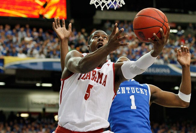 ATLANTA, GA - MARCH 12:  Tony Mitchell #5 of the Alabama Crimson Tide shoots against Darius Miller #1 of the Kentucky Wildcats during the semifinals of the SEC Men's Basketball Tournament at Georgia Dome on March 12, 2011 in Atlanta, Georgia.  (Photo by Kevin C. Cox/Getty Images)