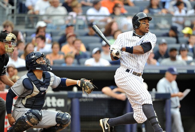 NEW YORK, NY - AUGUST 13: Curtis Granderson #14 of the New York Yankees watches his solo home run to lead off the bottom of the fifth inning against the Tampa Bay Rays at Yankee Stadium on August 13, 2011 in the Bronx borough of New York City. (Photo by Christopher Pasatieri/Getty Images)