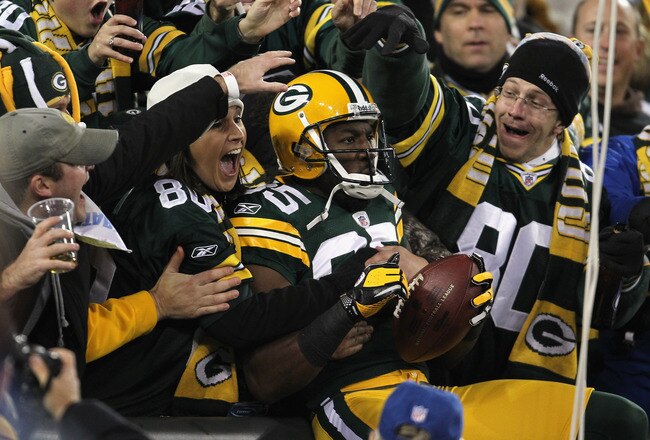 GREEN BAY, WI - NOVEMBER 14:  Greg Jennings #85 of the Green Bay Packers celebrates with fans after he scored on a 24-yard touchdown reception in the first quarter against the Minnesota Vikings at Lambeau Field on November 14, 2011 in Green Bay, Wisconsin.  (Photo by Jonathan Daniel/Getty Images)