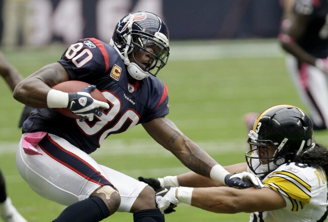 HOUSTON, TX - OCTOBER 02: Wide receiver Andre Johnson #80 of the Houston Texans breaks the tackled of safety Troy Polamalu #43 of the Pittsburgh Steelers on October 2, 2011 at Reliant Stadium in Houston, Texas.Texans won 17 to 10. (Photo by Thomas B. Shea/Getty Images)