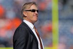 DENVER, CO - OCTOBER 09:  John Elway, Executive Vice President of Football Operations for the Denver Broncos, looks on from the bench as the Broncos warm up prior to facing the San Diego Chargers at Sports Authority Field at Mile High on October 9, 2011 in Denver, Colorado. The Chargers defeated the Broncos 29-24.  (Photo by Doug Pensinger/Getty Images)