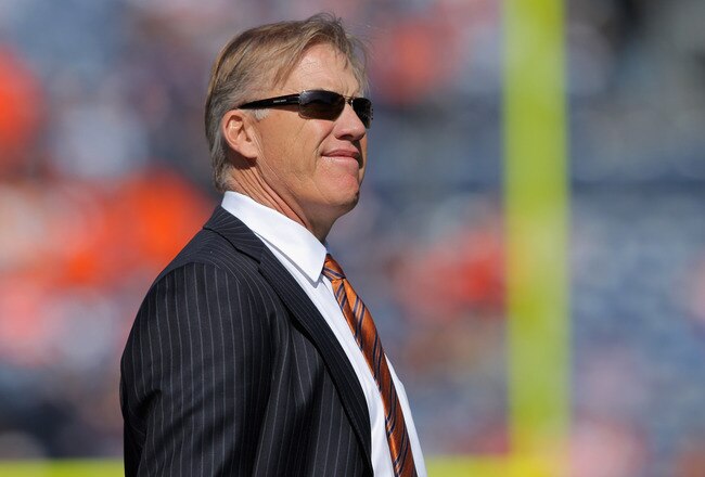 DENVER, CO - OCTOBER 09:  John Elway, Executive Vice President of Football Operations for the Denver Broncos, looks on from the bench as the Broncos warm up prior to facing the San Diego Chargers at Sports Authority Field at Mile High on October 9, 2011 in Denver, Colorado. The Chargers defeated the Broncos 29-24.  (Photo by Doug Pensinger/Getty Images)