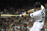 SAN DIEGO, CA - JUNE 24:  Anthony Rizzo #27 of the San Diego Padres hits a double during the sixth inning of a baseball game against the Atlanta Braves at Petco Park on June 24, 2011 in San Diego, California.  (Photo by Denis Poroy/Getty Images)