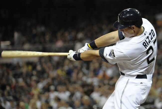 SAN DIEGO, CA - JUNE 24:  Anthony Rizzo #27 of the San Diego Padres hits a double during the sixth inning of a baseball game against the Atlanta Braves at Petco Park on June 24, 2011 in San Diego, California.  (Photo by Denis Poroy/Getty Images)