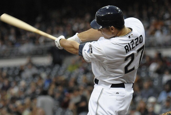 SAN DIEGO, CA - JUNE 28:  Anthony Rizzo #27 of the San Diego Padres hits a double during the fourth inning of a baseball game against the Kansas City Royals at Petco Park on June 28, 2011 in San Diego, California.  The Padres won 4-2. (Photo by Denis Poroy/Getty Images)