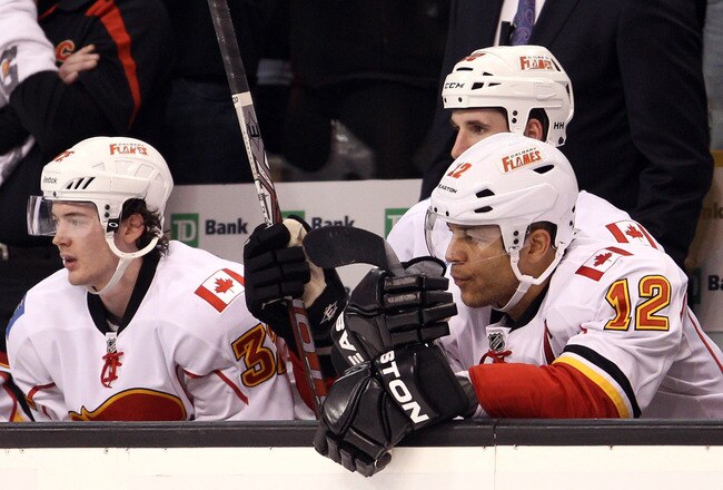 BOSTON, MA - JANUARY 05:  Jarome Iginla #12 and Paul Byron #32 of the Calgary Flames sit on the bench in the third period against the Boston Bruins on January 5, 2012 at TD Garden in Boston, Massachusetts. The Boston Bruins defeated the Calgary Flames 9-0.  (Photo by Elsa/Getty Images)
