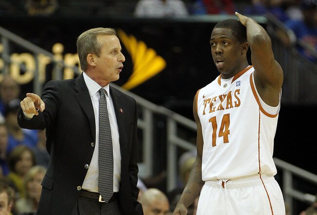 KANSAS CITY, MO - MARCH 11:  Head coach Rick Barnes of the Texas Longhorns speaks with J'Covan Brown #14 during their semifinal game against the Texas A&M Aggies in the 2011 Phillips 66 Big 12 Men's Basketball Tournament at Sprint Center on March 11, 2011 in Kansas City, Missouri.  (Photo by Jamie Squire/Getty Images)