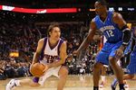 PHOENIX - DECEMBER 11:  Steve Nash #13 of the Phoenix Suns handles the ball under pessure from Dwight Howard #12 of the Orlando Magic during the NBA game at US Airways Center on December 11, 2009 in Phoenix, Arizona. The Suns defeated the Magic 106-103.  NOTE TO USER: User expressly acknowledges and agrees that, by downloading and or using this photograph, User is consenting to the terms and conditions of the Getty Images License Agreement.  (Photo by Christian Petersen/Getty Images)