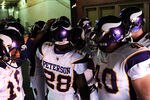 LANDOVER, MD - DECEMBER 24: Running back Adrian Peterson #28 of the Minnesota Vikings huddles up with teammates before playing against the Washington Redskins at FedEx Field on December 24, 2011 in Landover, Maryland. (Photo by Patrick Smith/Getty Images)