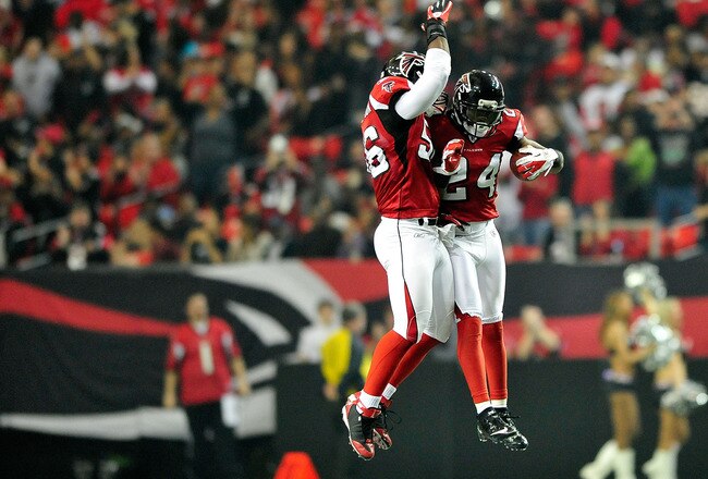 ATLANTA, GA - JANUARY 01:  Sean Witherspoon #56 and Dominique Franks #24 of the Atlanta Falcons celebrate Franks' interception of Josh Freeman #5 of the Tampa Bay Buccaneers during play at the Georgia Dome on January 1, 2012 in Atlanta, Georgia.  (Photo by Grant Halverson/Getty Images)
