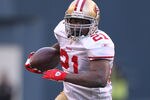 SEATTLE - DECEMBER 24:  Running back Frank Gore #21 of the San Francisco 49ers rushes against the Seattle Seahawks at CenturyLink Field on December 24, 2011 in Seattle, Washington. (Photo by Otto Greule Jr/Getty Images)
