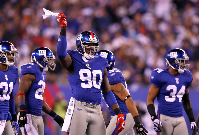 EAST RUTHERFORD, NJ - JANUARY 01:  Jason Pierre-Paul #90 of the New York Giants reacts while playing against the Dallas Cowboys at MetLife Stadium on January 1, 2012 in East Rutherford, New Jersey.  (Photo by Al Bello/Getty Images)