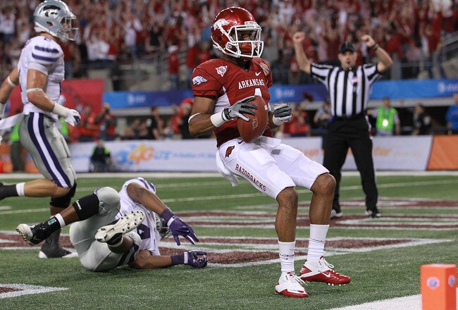 ARLINGTON, TX - JANUARY 06:  Jarius Wright #4 of the Arkansas Razorbacks makes a touchdown pass reception against Arthur Brown #4 of the Kansas State Wildcats during the Cotton Bowl at Cowboys Stadium on January 6, 2012 in Arlington, Texas.  (Photo by Ronald Martinez/Getty Images)