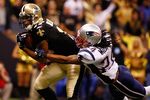 NEW ORLEANS - NOVEMBER 30:  Robert Meachem #17 of the New Orleans Saints catches a ball in front of Jonathan Wilhite #24 of the New England Patriots at the Louisiana Superdome on November 30, 2009 in New Orleans, Louisiana.  (Photo by Scott Halleran/Getty Images)