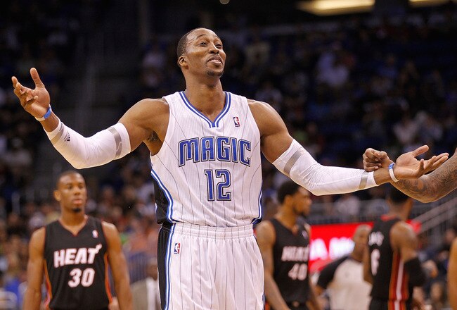 ORLANDO, FL - DECEMBER 21: Dwight Howard #12 of the Orlando Magic argues a call during a preseason game against the Miami Heat at Amway Center on December 21, 2011 in Orlando, Florida. NOTE TO USER: User expressly acknowledges and agrees that, by downloading and/or using this Photograph, User is consenting to the terms and conditions of the Getty Images License Agreement.  (Photo by Mike Ehrmann/Getty Images)