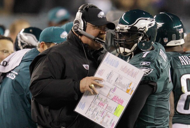 PHILADELPHIA, PA - DECEMBER 18:  Michael Vick #7 of the Philadelphia Eagles talks with head coach Andy Reid after Vick scored a touchdown against the New York Jets during the first half at Lincoln Financial Field on December 18, 2011 in Philadelphia, Pennsylvania.  (Photo by Rob Carr/Getty Images)