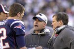 New England Patriots coach Bill Belichick (right) and Josh McDaniels (center) with quarterback Tom Brady   against the New York Jets in  an NFL wild card playoff game Jan. 7, 2007 in Foxborough.  The Pats won 37 - 16. (Photo by Al Messerschmidt/Getty Images)
